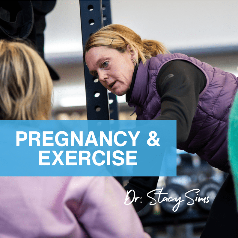 A female fitness instructor guiding a pregnant woman in a gym setting, emphasizing safe exercise during pregnancy.